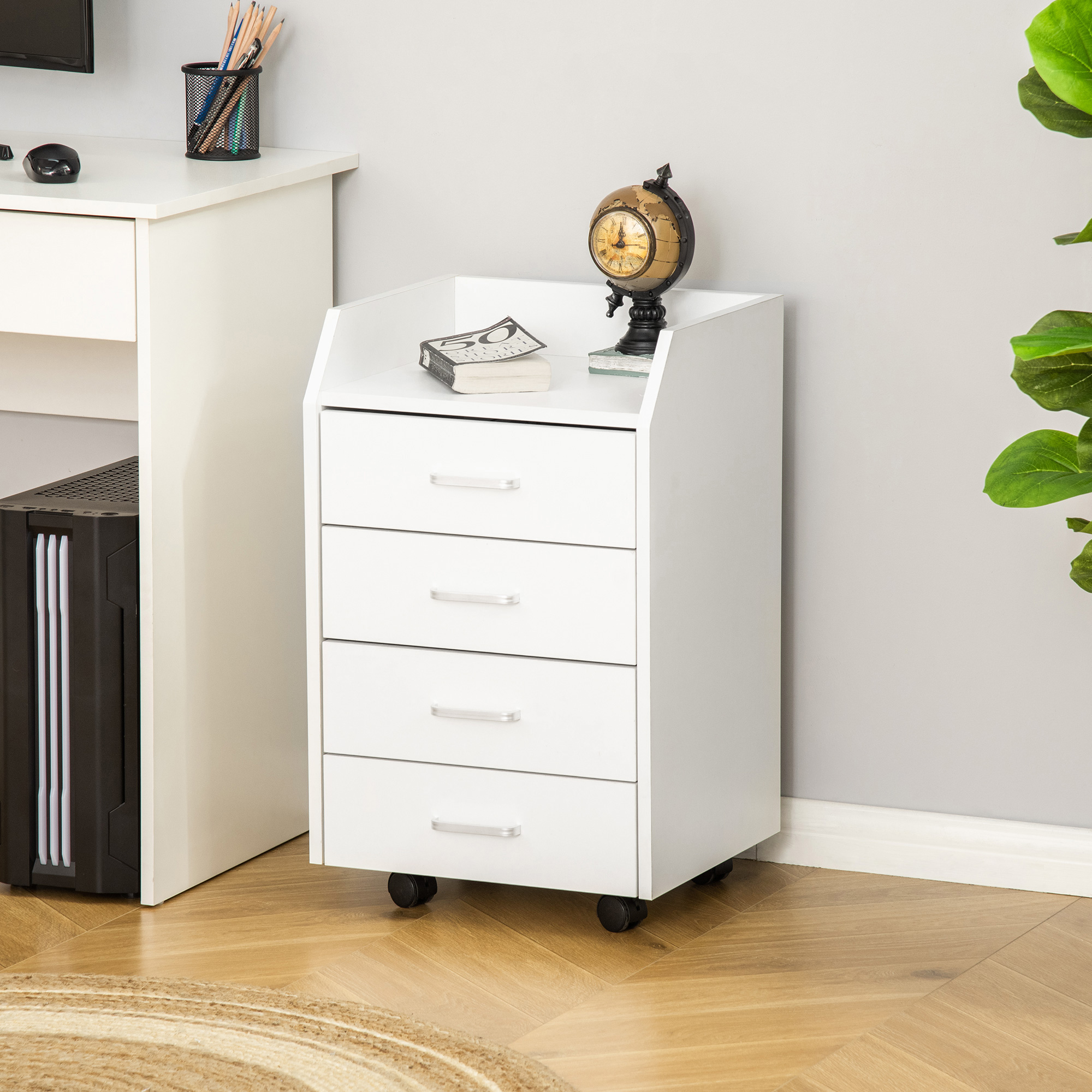 Cajonera de oficina blanca con balda superior colocada junto a un escritorio de trabajo